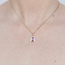 Load image into Gallery viewer, talayee fine jewelry's persepolis pendant featuring a hot pink sapphire set in 14k gold on figure