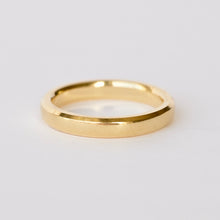 Load image into Gallery viewer, 18k Gold beveled ring on a light gray background