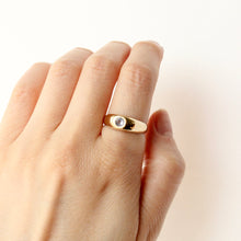 Load image into Gallery viewer, Talayee Fine Jewelry's signature Juno flush set gemstone dome ring with a tanzanite set in 14k gold on hand. Cool girl engagement rings for her and for him.