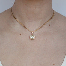 Load image into Gallery viewer, Talayee Fine Jewelry's Bloom Pendant made of 14k yellow gold and alab diamond in a floral like setting modeled on a person's neck.