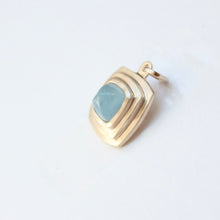 Load image into Gallery viewer, talayee fine jewelry persepolis pendant featuring a milky blue aqaumarine cabochon set in 14k gold in a triple bezel shown on a white background
