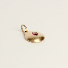 Load image into Gallery viewer, Talayee Fine Jewelry's domed charm pendant with a garnet flush set in 14k yellow gold. Handmade in san francisco