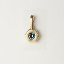 Load image into Gallery viewer, 14k yellow gold pendant with a blue montana sapphire gemstone shown on a light gray background. Talayee Fine jewelry hexad charm.