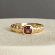 Load image into Gallery viewer, Talayee Fine Jewelry's Atousa Bezel ring featuring a purple asscher cut spinel set in 14k gold shown on white silk against a black background