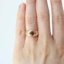 Load image into Gallery viewer, A gold signet ring with a round tri-color sapphire shown on hand