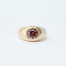 Load image into Gallery viewer, A gold signet-style ring featuring a round faceted tri-color sapphire in a flush setting, shown on a white background.
