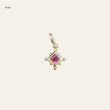 Load image into Gallery viewer, Gold charm pendant with a ruby on a white background