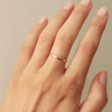 Load image into Gallery viewer, 2mm 14k gold vow ring on finger. best online jewelry stores reddit