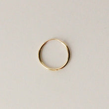 Load image into Gallery viewer, 14k gold flexible tube hoop on light grey background
