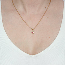 Load image into Gallery viewer, 14k yellow gold hexagonal pendant with a pink garnet gemstone shown on figure. Talayee Fine Jewelry Hexad Charm.
