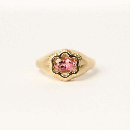 Talayee Fine Jewelry's one of a kind Bloom Ring. 18k gold ring with a oval pink Tourmaline set in a floral setting shown on a white background.