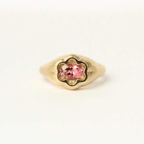 Talayee Fine Jewelry's Bloom Ring made of 18k yellow gold and a pink tourmaline in a floral like setting on a white background.