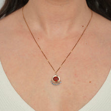 Load image into Gallery viewer, 14k yellow gold persepolis pendant with an orange garnet and blue sapphire fringe shown on figure
