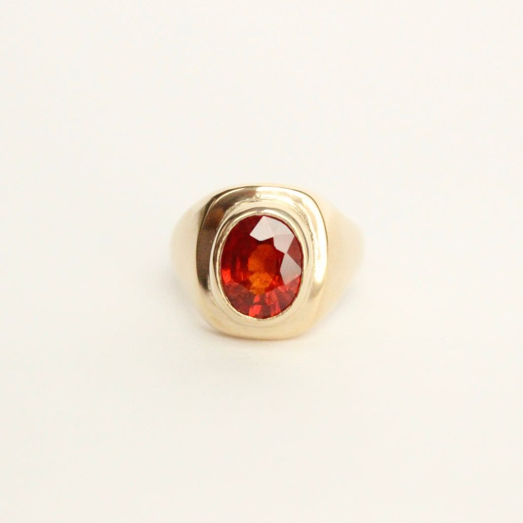 Talayee Fine Jewelry's Signature Persepolis Gemstone Signet ring with a orange spessartite garnet set in 14k yellow gold that can be the ultimate cool girl engagement ring. Bold gold jewelry for her and for him. 
