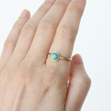 Load image into Gallery viewer, 14k yellow gold and chrysocolla ring on figure.
