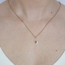 Load image into Gallery viewer, Talayee Fine Jewelry&#39;s Persepolis Pendant with a hexagonal cut sunstone set in 14k gold on modeled on a necklace
