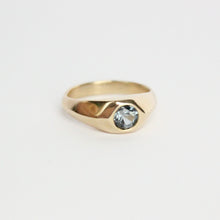Load image into Gallery viewer, 14k yellow gold ring with a gray flush set spinel on a light gray background
