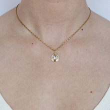 Load image into Gallery viewer, talayee fine jewelry&#39;s persepolis pendant set with an asscher cut pink spinel in 18k gold shown on figure
