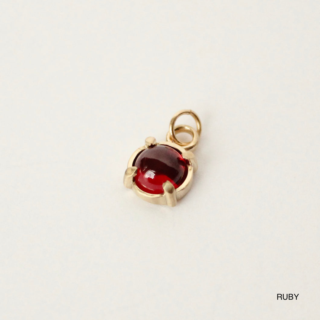 14k yellow gold and ruby birthstone charm