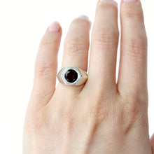Load image into Gallery viewer, A silver-toned signet-style ring with a smokey quartz, shown worn on hand against a plain white background.
