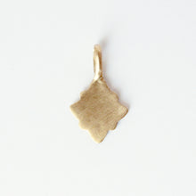 Load image into Gallery viewer, 14k gold charm in a geometric shape on a light gray background.
