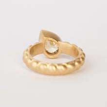 Load image into Gallery viewer, Talayee Fine Jewelry's Atousa Bezel Ring featuring a pear shaped golden zircon bezel set in 18k gold on the signature textured band shown on a white background
