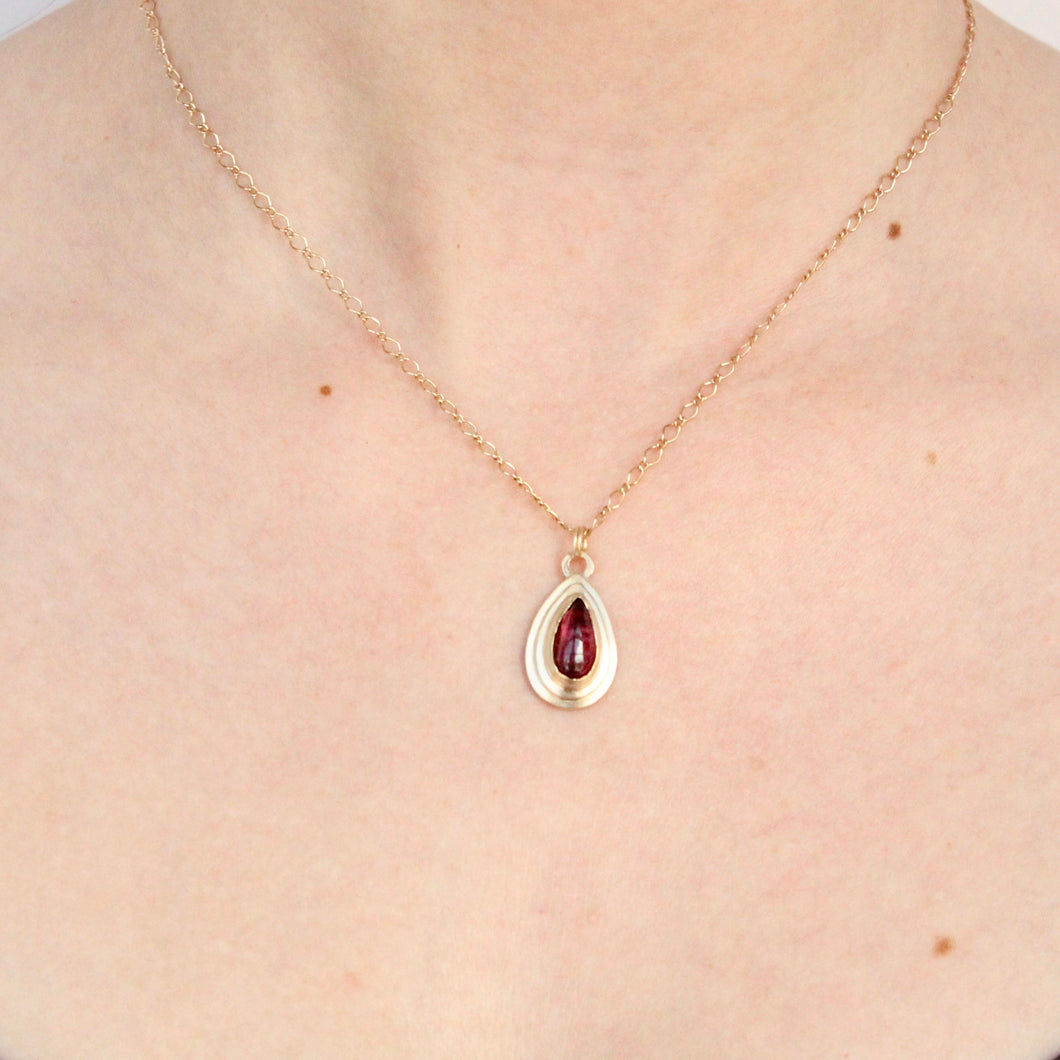 14k gold and bright pink pear shaped tourmaline pendant from talayee fine jewelry's persepolis collection