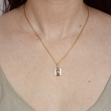 Load image into Gallery viewer, talayee fine jewelry&#39;s bestselling persepolis pendant with an emerald cut amethyst set in 14k yellow gold on figure
