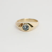 Load image into Gallery viewer, 14k yellow gold ring with a gray flush set spinel on a light gray background
