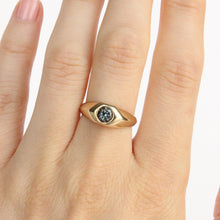 Load image into Gallery viewer, 14k yellow gold ring with a gray flush set spinel on figure

