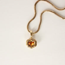 Load image into Gallery viewer, Talayee Fine Jewelry&#39;s Bloom Pendant. 18k yellow gold pendant with an orange garnet set in a floral style setting shown on a snake chain on a white background.
