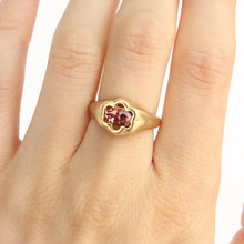 Load image into Gallery viewer, 8k gold ring with a oval pink Tourmaline set in a floral setting shown on hand
