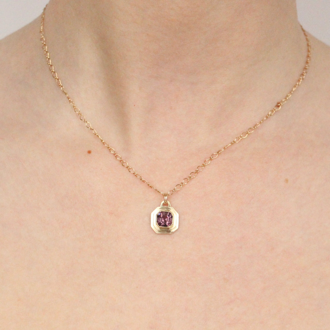 14k yellow gold pendant featuring a purple asscher cut spinel handmade by talayee fine jewelry