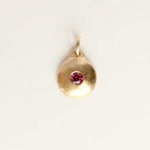 Load image into Gallery viewer, Talayee Fine Jewelry&#39;s domed charm pendant with a garnet flush set in 14k yellow gold
