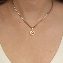 Load image into Gallery viewer, Talayee Fine Jewelry&#39;s Bloom Pendant made of 18k yellow gold and an orange garnet in a floral like setting on figure
