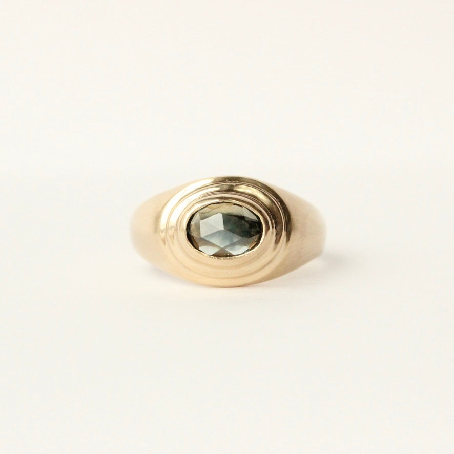 talayee fine jewelry's persepolis ring featuring a rose cut montana sapphire set in 14k gold shown on a white background