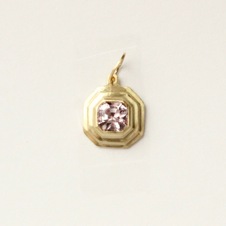 talayee fine jewelry's persepolis pendant set with an asscher cut pink spinel in 18k gold shown on a white background