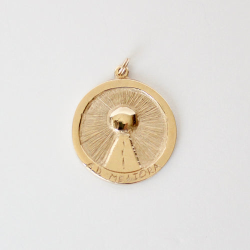14k yellow gold medallion pendant with sun imagery