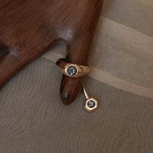 Load image into Gallery viewer, 14k yellow gold and gray spinel ring and pendant styled on figure
