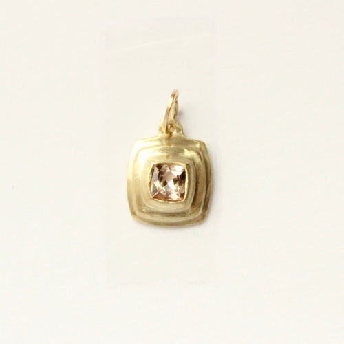 talayee fine jewelry's persepolis pendant featuring an imperial topaz set in 18k gold shown on a white background
