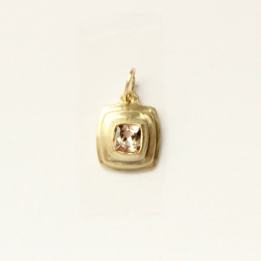 talayee fine jewelry's persepolis pendant featuring an imperial topaz set in 18k gold shown on a white background