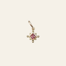 Load image into Gallery viewer, Gold charm pendant with a pink spinel on a light gray background

