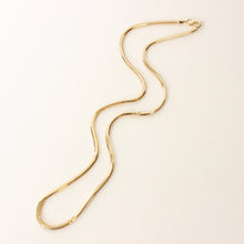 Load image into Gallery viewer, 14k yellow gold 1.5mm thick snake chain for necklace layering on white background
