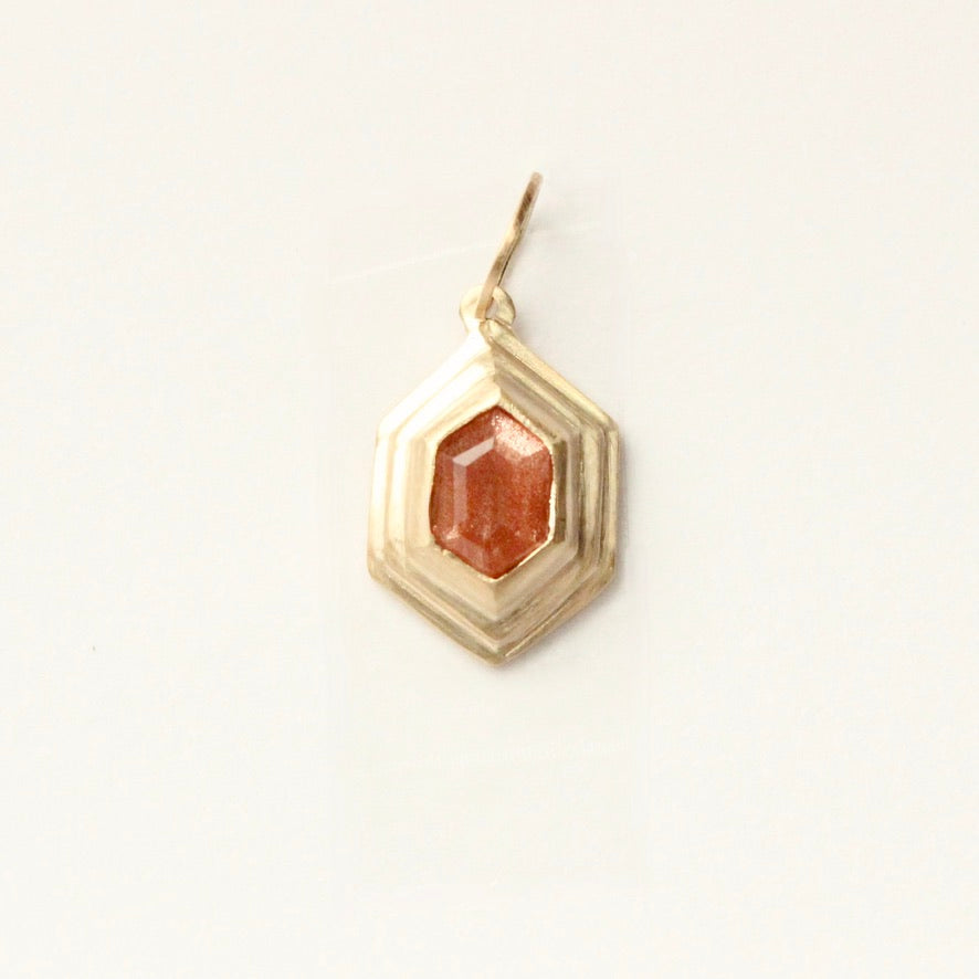 Talayee Fine Jewelry's Persepolis Pendant with a hexagonal cut sunstone set in 14k gold on a white background