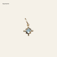 Load image into Gallery viewer, Gold charm pendant with an aquamarine on a light gray background
