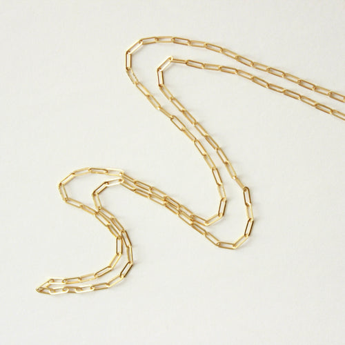 paperclip chain link necklace on white background