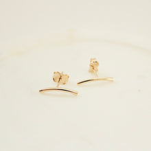 Load image into Gallery viewer, this is how does jewelry. 14k gold arched bar earrings on white background
