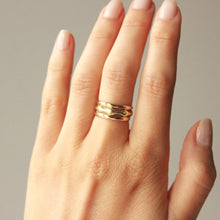 Load image into Gallery viewer, 14k gold 3 piece vow ring set modeled on figure.
